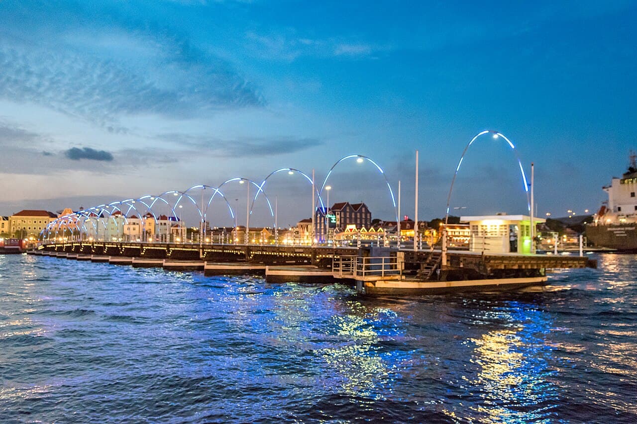 Queen Emma Bridge and Willemstad waterfront lit up at night, Curaçao